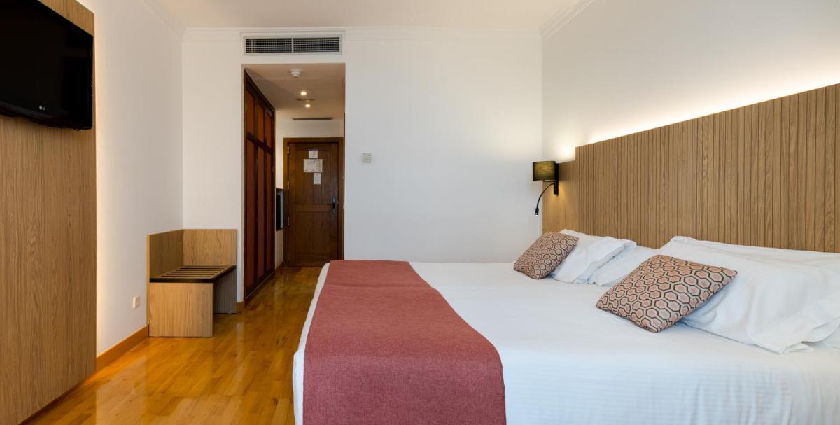 Cama o camas de una habitación en Hotel Silken Villa de Laguardia