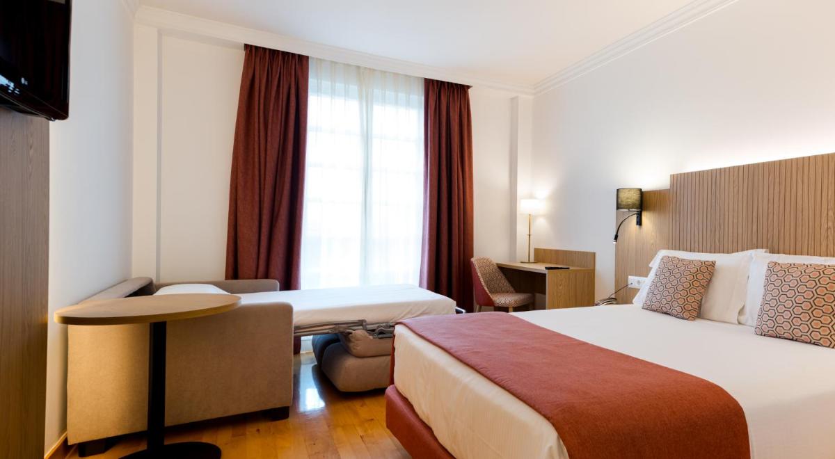 Cama o camas de una habitación en Hotel Silken Villa de Laguardia