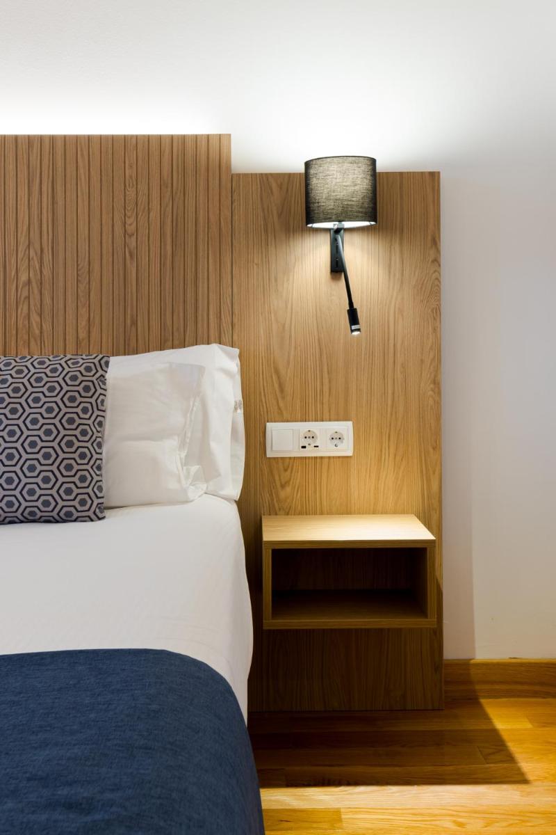 Cama o camas de una habitación en Hotel Silken Villa de Laguardia