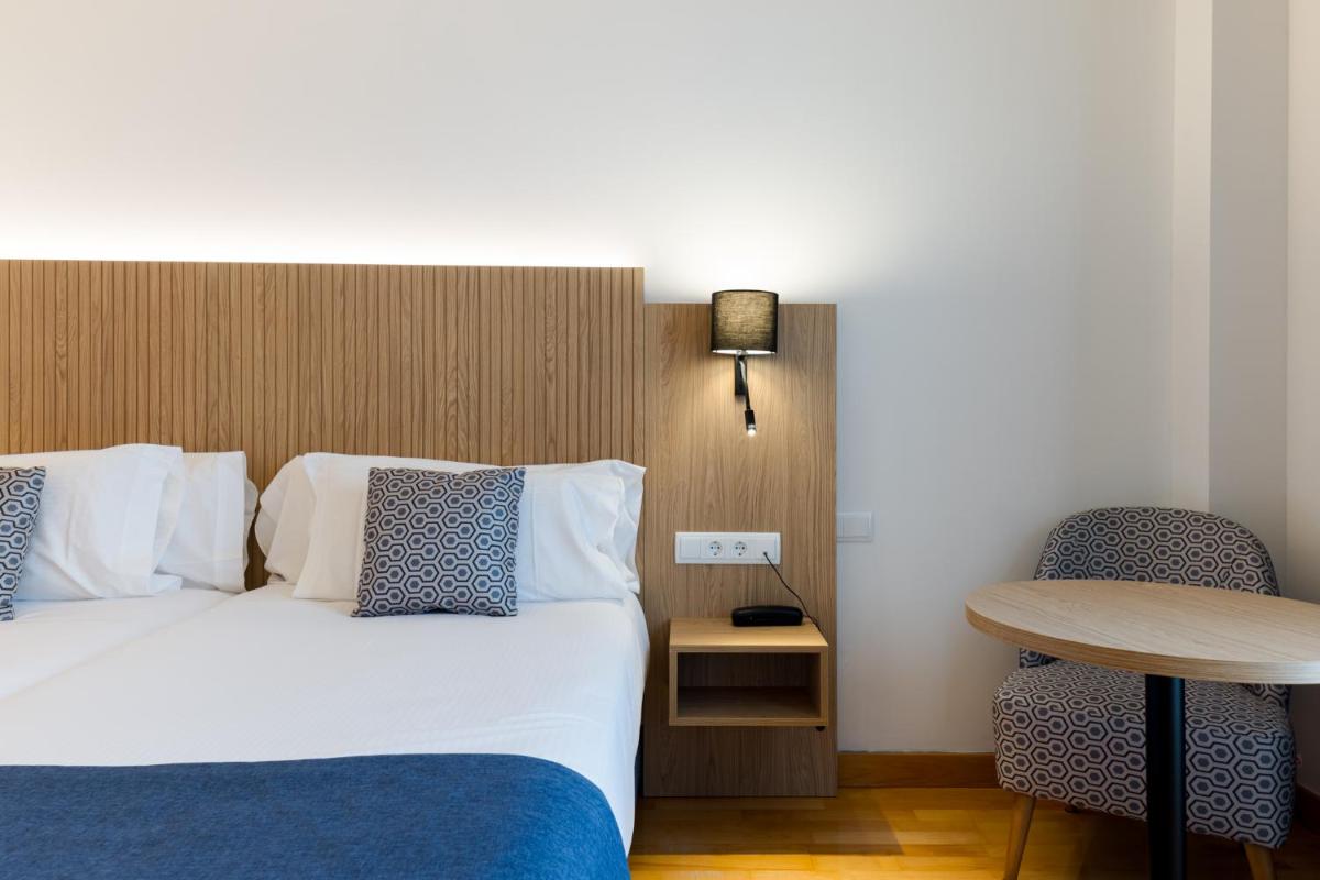 Cama o camas de una habitación en Hotel Silken Villa de Laguardia