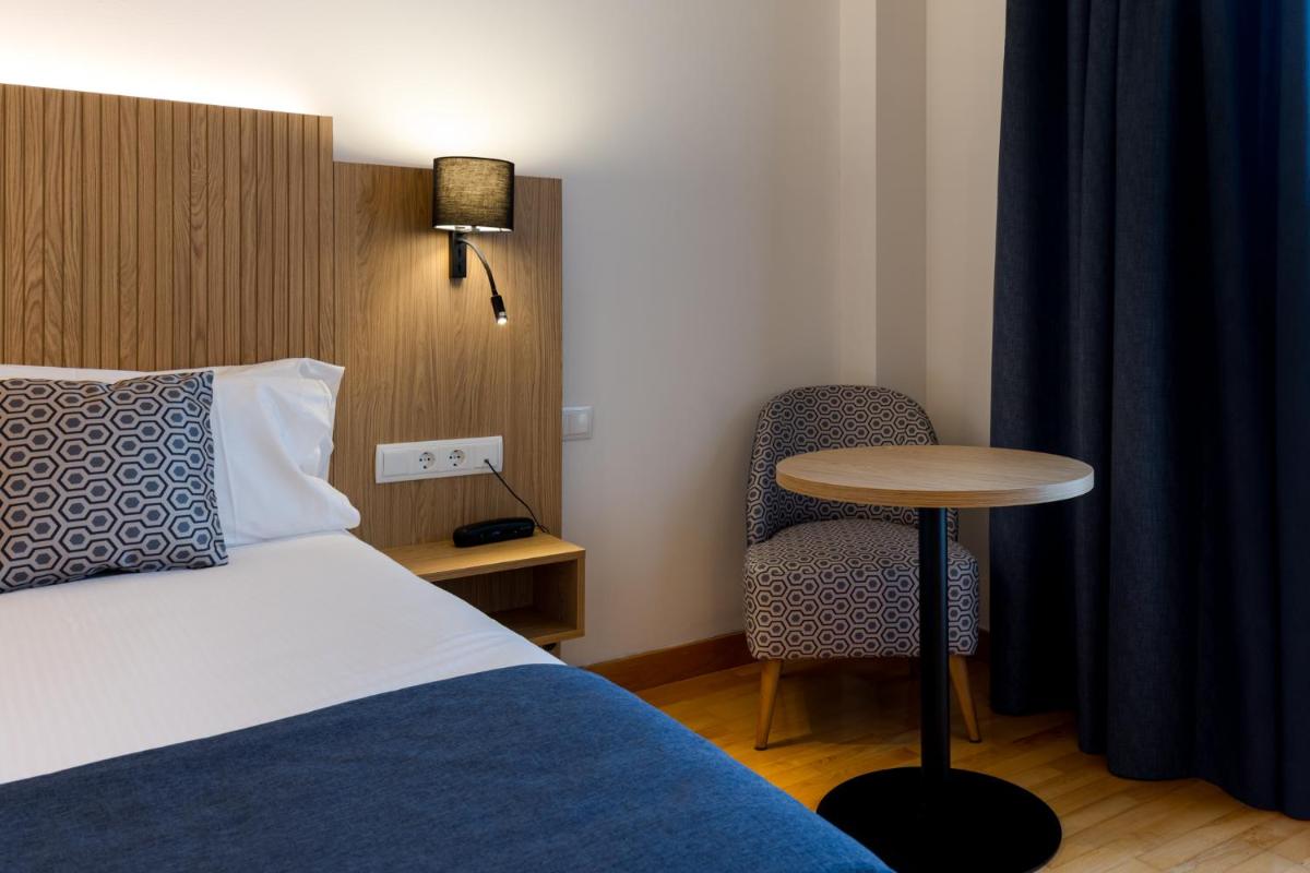 Cama o camas de una habitación en Hotel Silken Villa de Laguardia