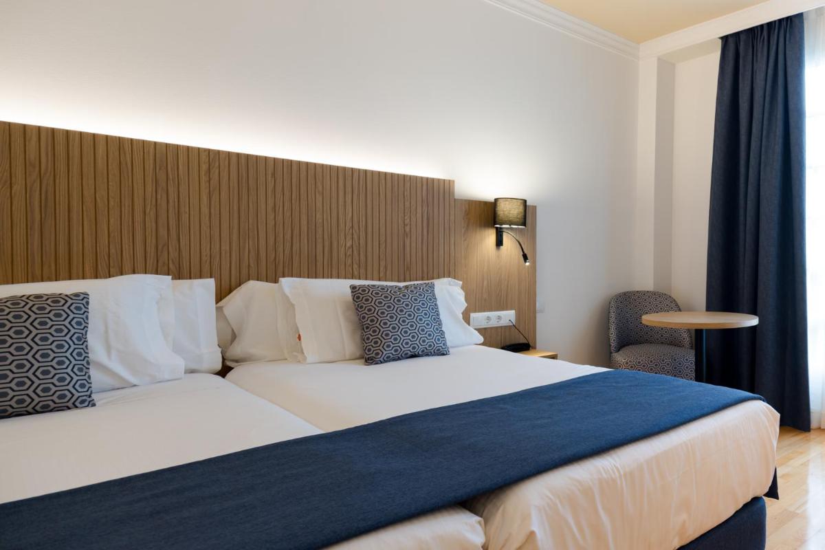 Cama o camas de una habitación en Hotel Silken Villa de Laguardia