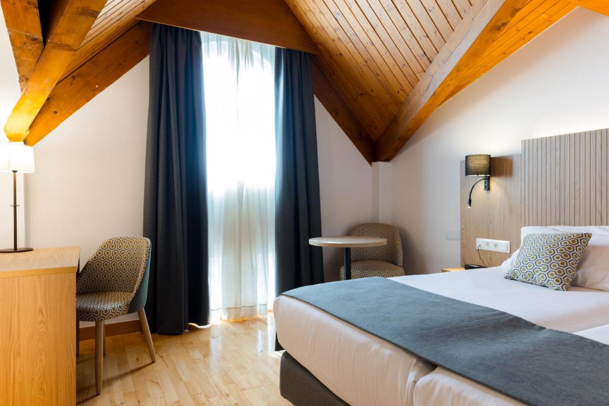 Cama o camas de una habitación en Hotel Silken Villa de Laguardia