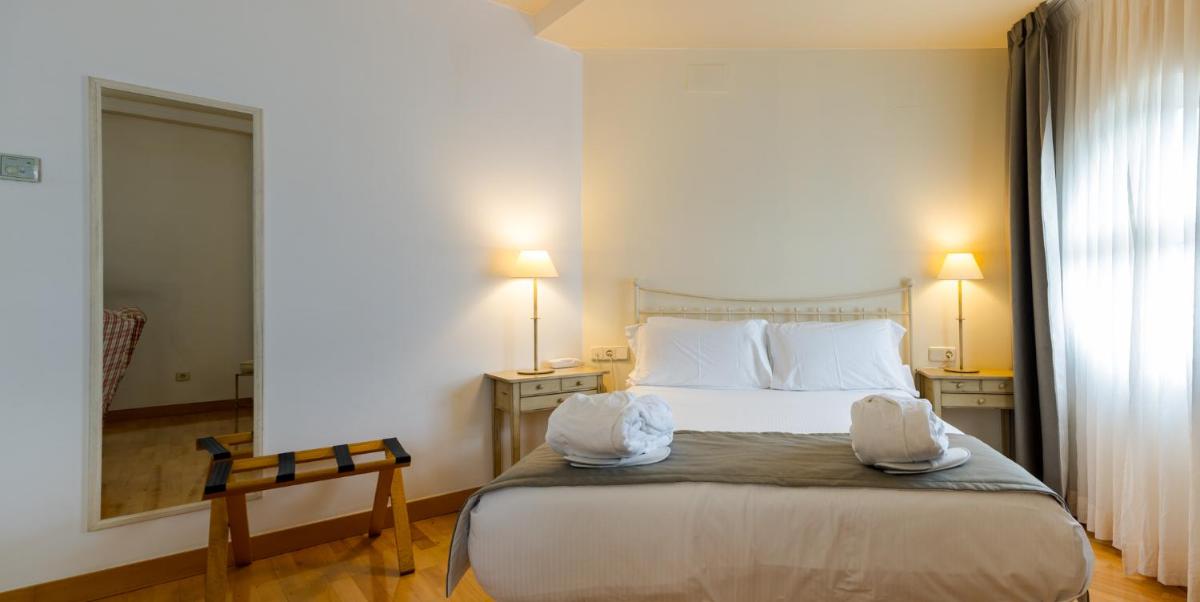 Cama o camas de una habitación en Hotel Silken Villa de Laguardia