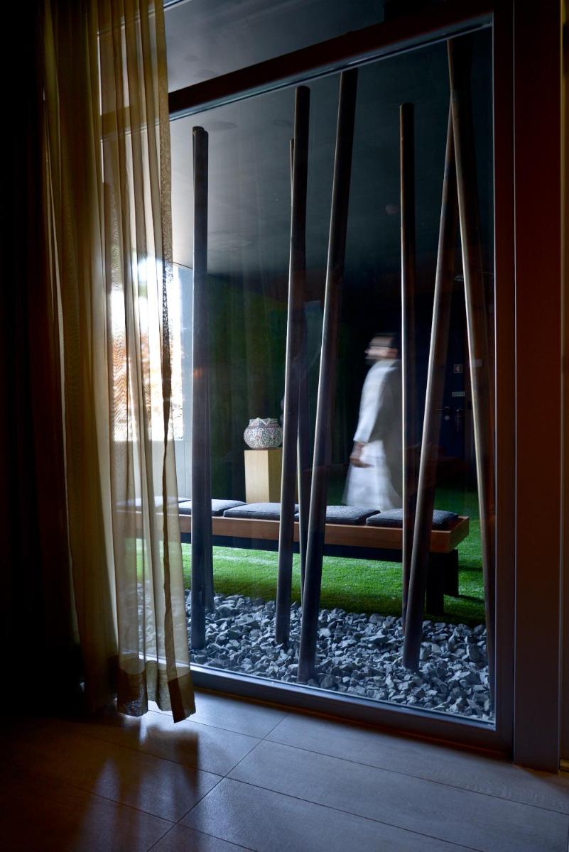 Uma cama ou camas num quarto em Evidencia Belverde Hotel