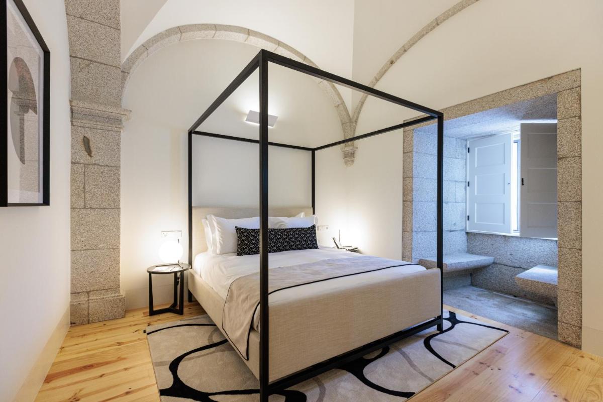 Uma cama ou camas num quarto em MS Collection Arouca - Mosteiro de Arouca