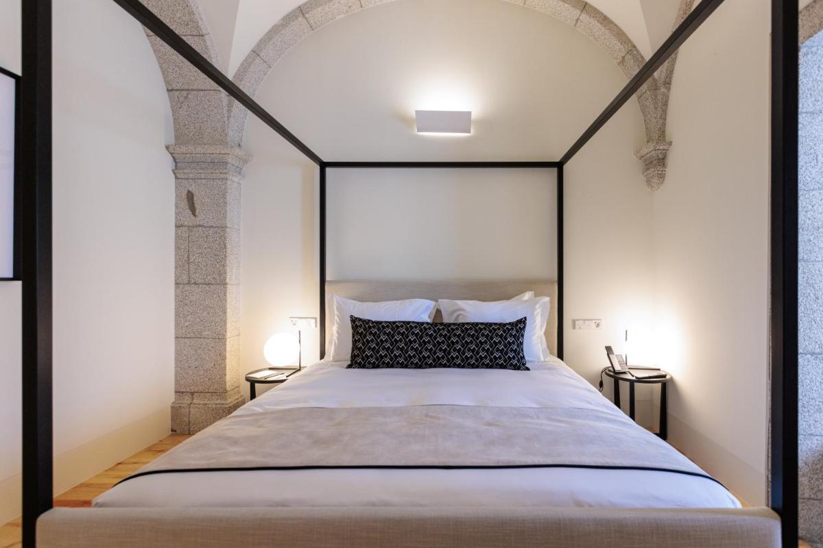 Uma cama ou camas num quarto em MS Collection Arouca - Mosteiro de Arouca