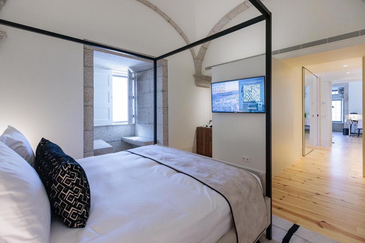 Uma cama ou camas num quarto em MS Collection Arouca - Mosteiro de Arouca