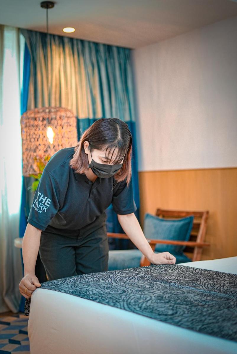a woman wearing a face mask looking at a table at The Park Bangalore, MG Road in Bengaluru a woman wearing a face mask looking at a table at The Park Bangalore, MG Road in Bengaluru