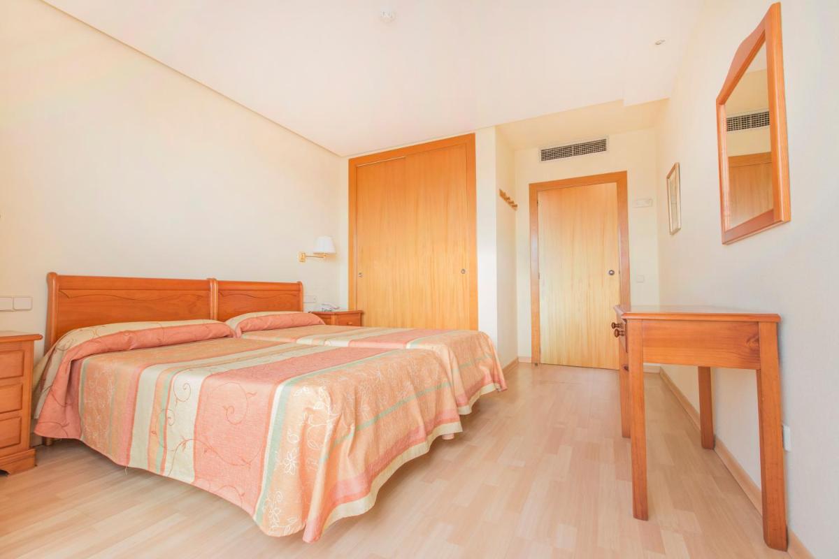Cama o camas de una habitación en Hotel Tres Anclas