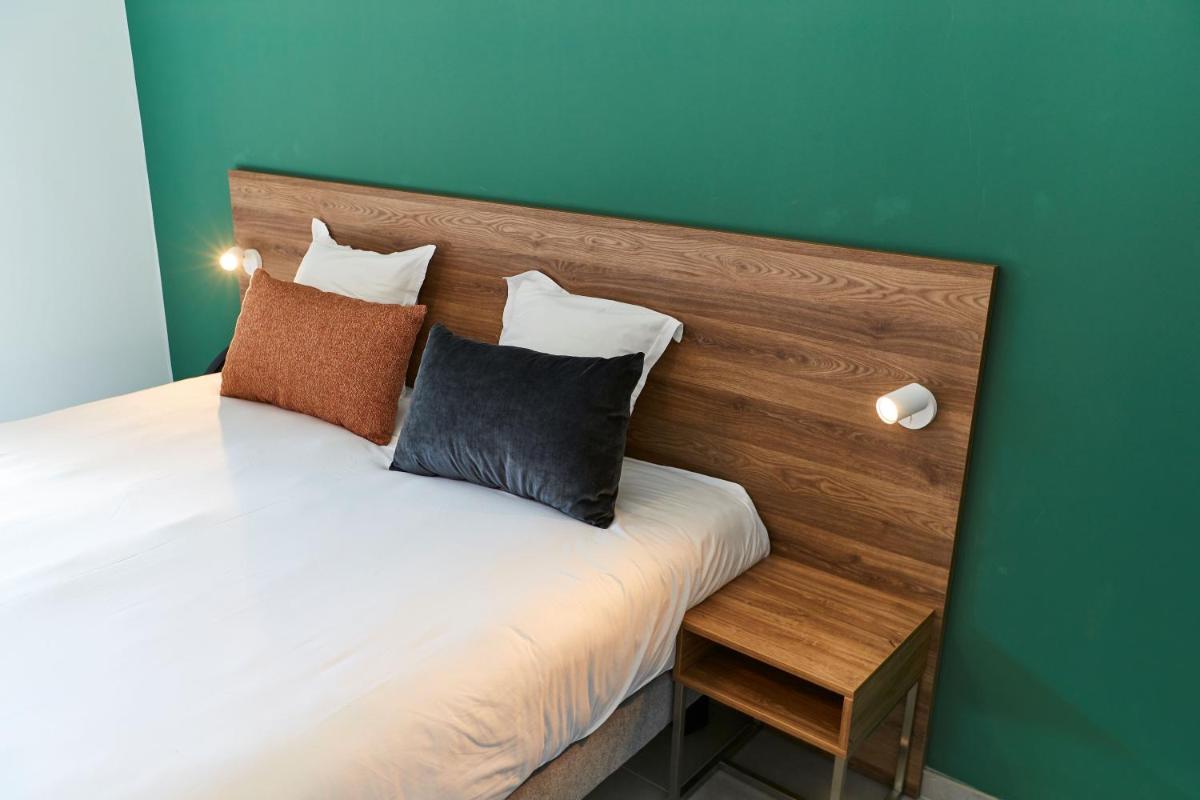 Un ou plusieurs lits dans un hébergement de l'établissement Pure Thermal Residence