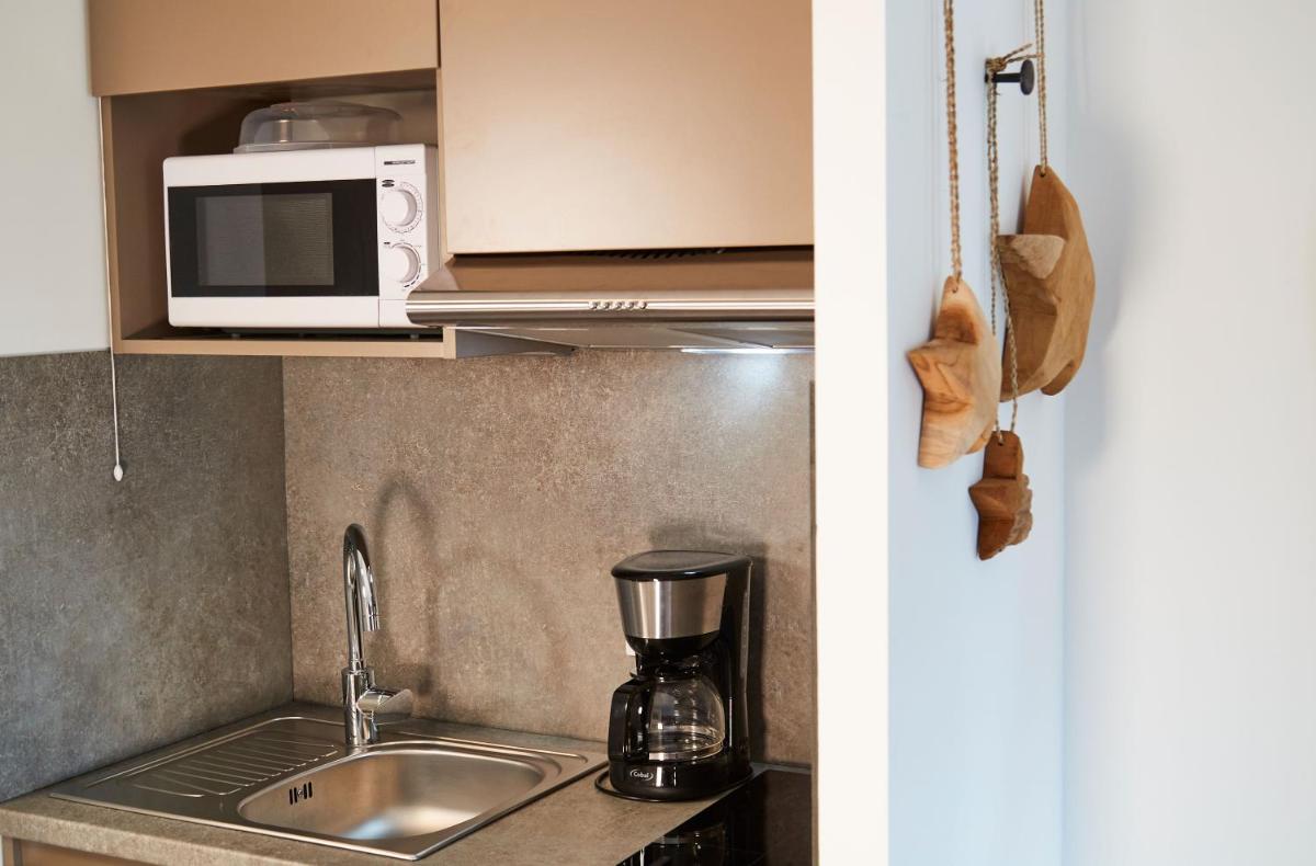 Cuisine ou kitchenette dans l'établissement Pure Thermal Residence