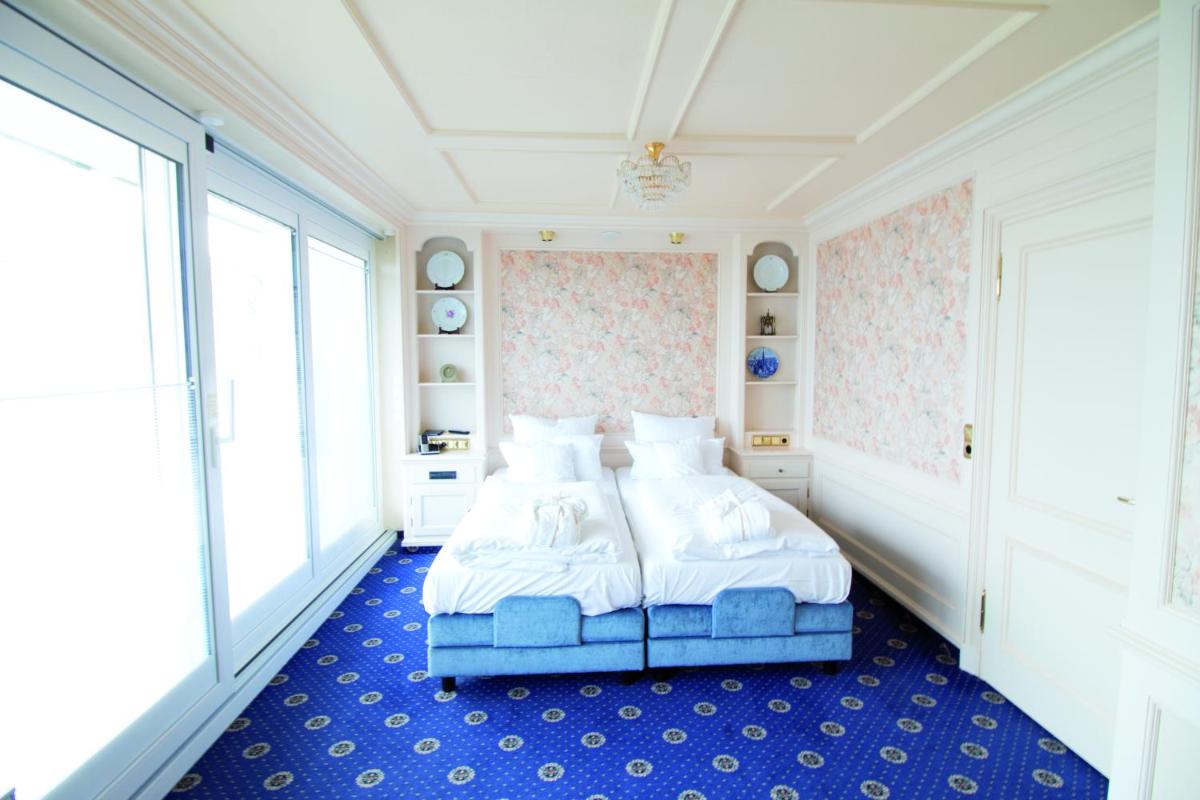 Ein Bett oder Betten in einem Zimmer der Unterkunft Hotel Strandperle