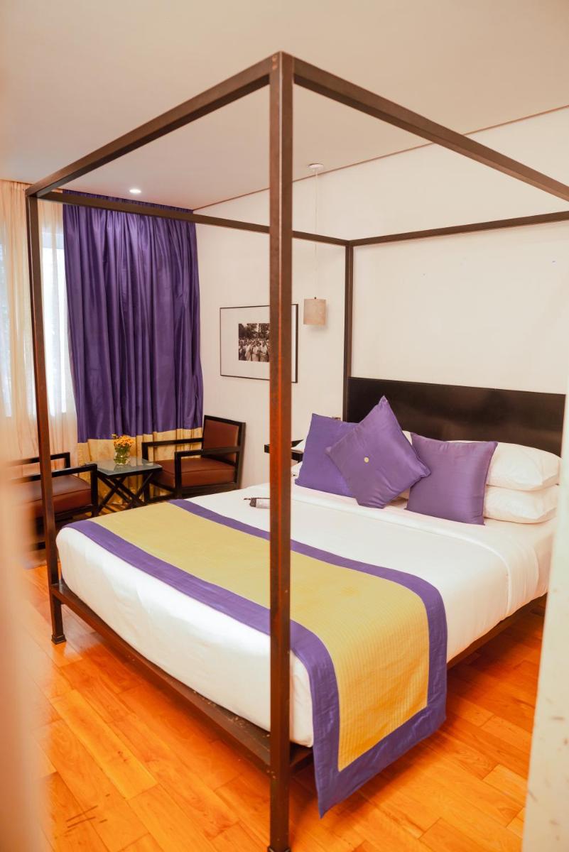 a bedroom with a large bed with a canopy at The Park Bangalore, MG Road in Bengaluru a bedroom with a large bed with a canopy at The Park Bangalore, MG Road in Bengaluru