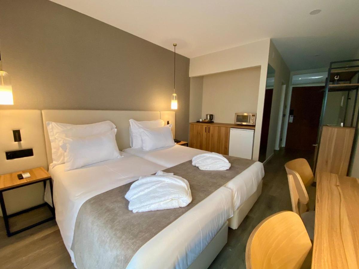 Uma cama ou camas num quarto em AP Sines - Costa Alentejana