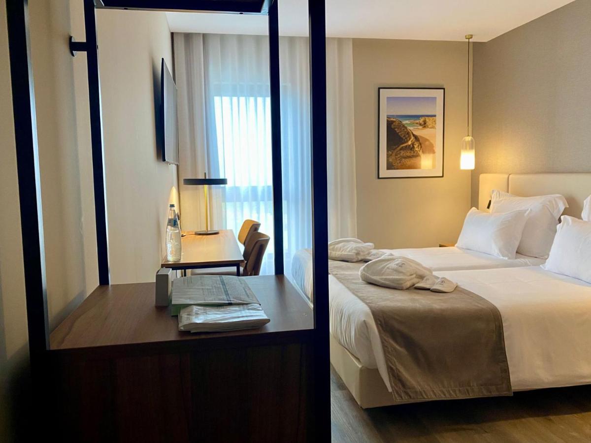 Uma cama ou camas num quarto em AP Sines - Costa Alentejana
