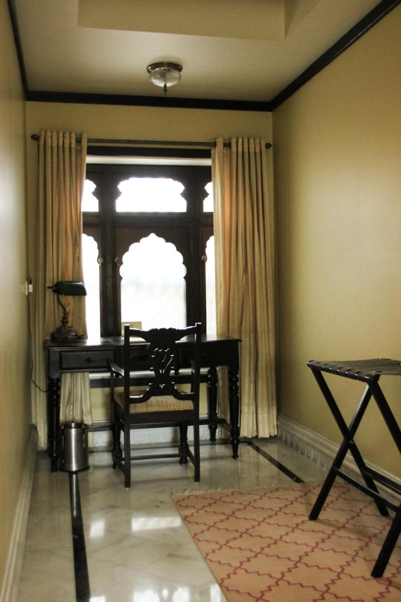 a room with a desk and a chair and a window at Royal Heritage Haveli - By Leisure Hotels in Jaipur