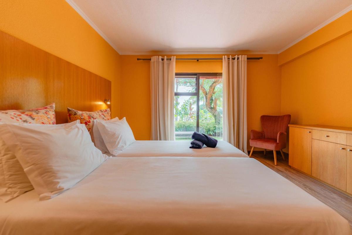 Uma cama ou camas num quarto em Quinta Splendida Wellness & Botanical Garden