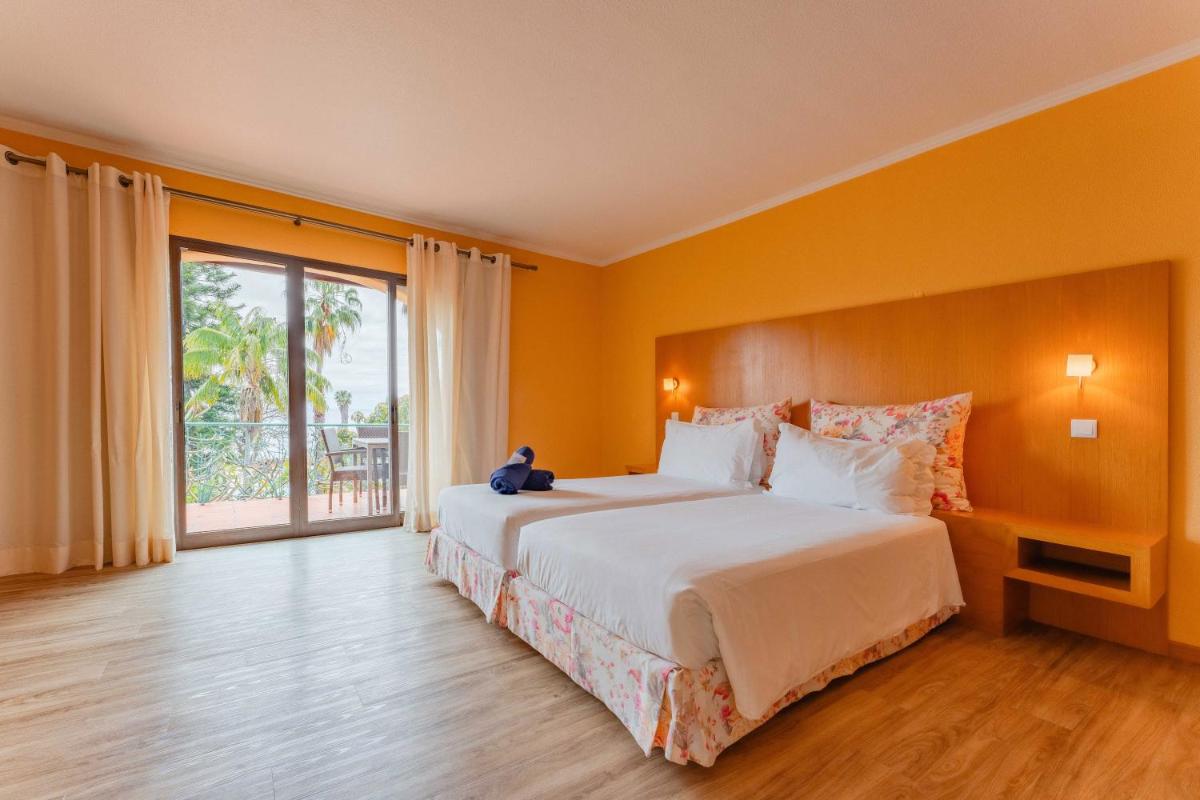 Uma cama ou camas num quarto em Quinta Splendida Wellness & Botanical Garden