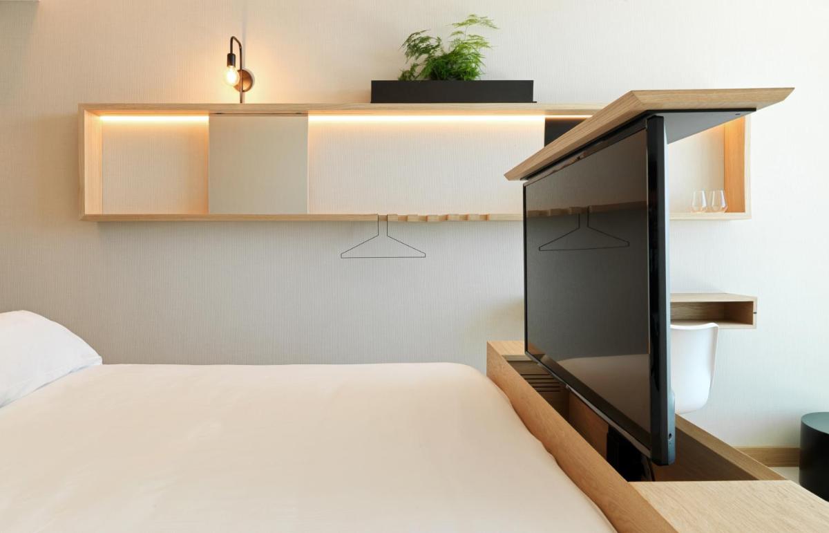 Cama o camas de una habitación en Noa Boutique Hotel