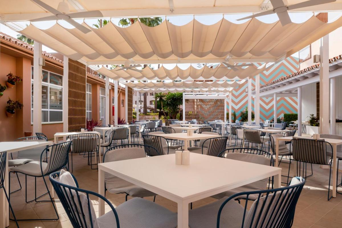 Un restaurante o sitio para comer en Los Amigos Beach Club