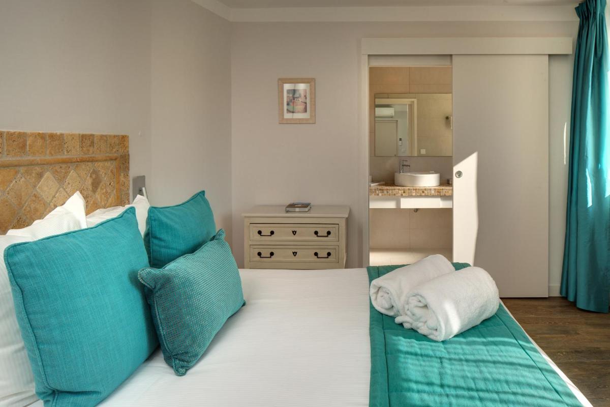 Un ou plusieurs lits dans un hébergement de l'établissement Le Cottage - Hotel & Spa