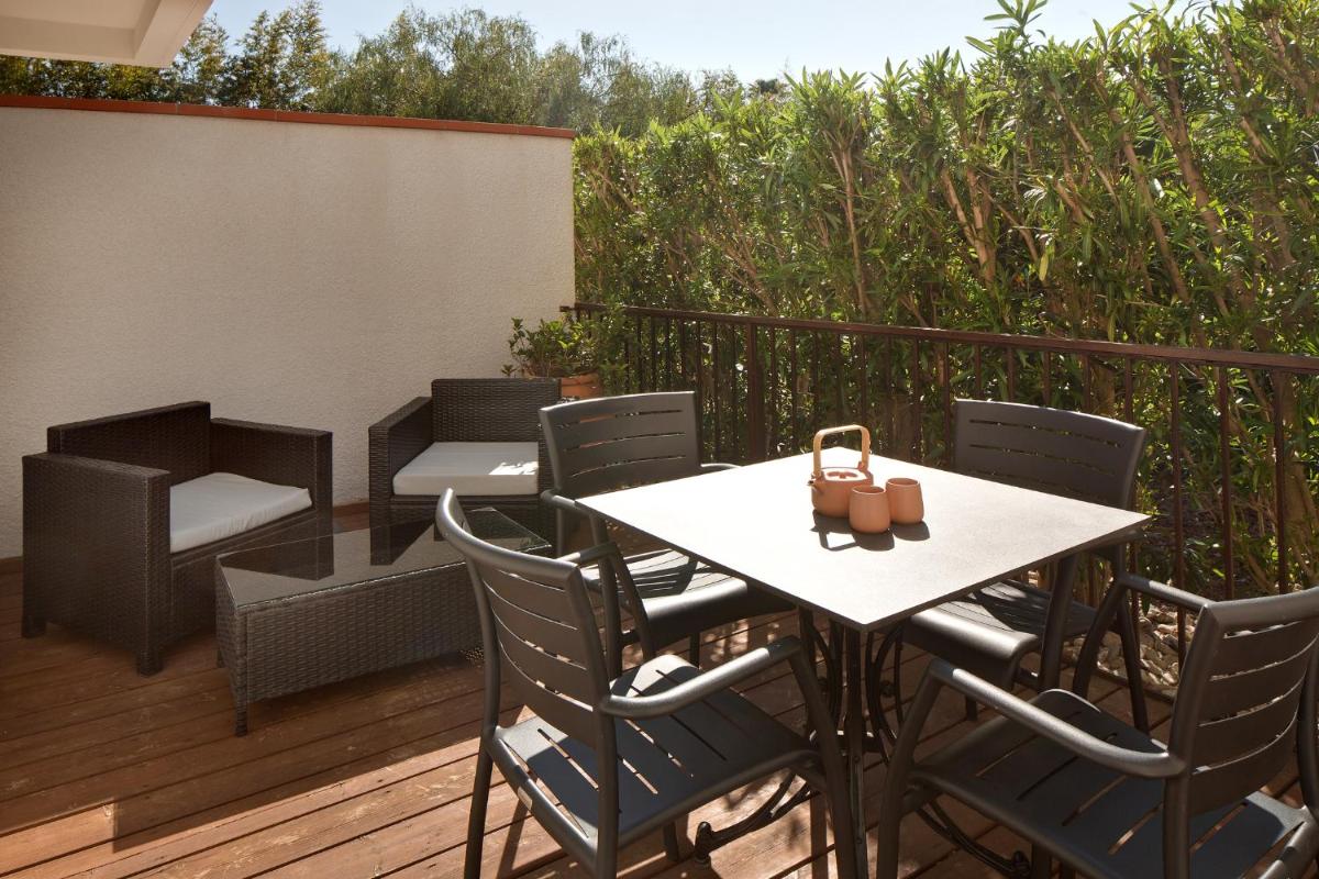 Coin salon dans l'établissement Le Cottage - Hotel & Spa