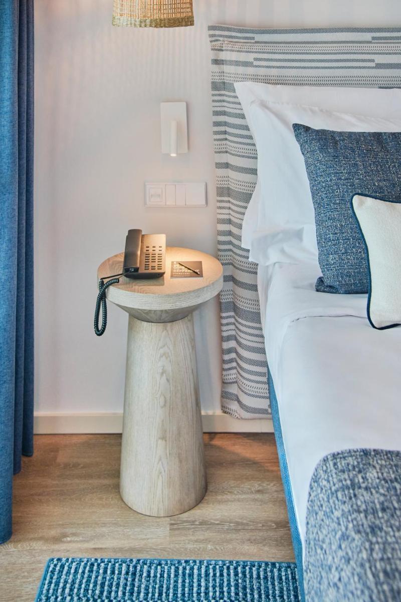 Uma cama ou camas num quarto em The Editory by the Sea Lagos