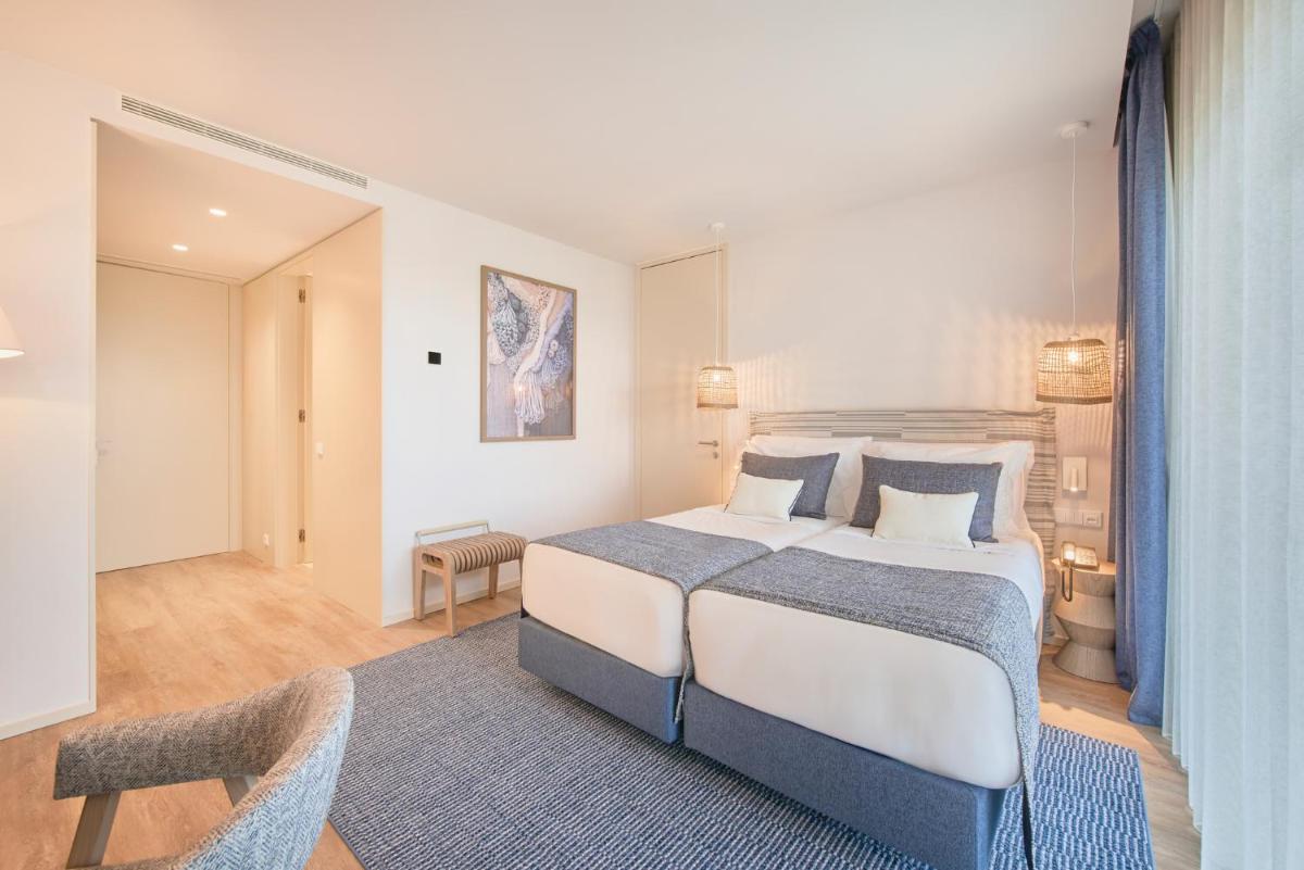 Uma cama ou camas num quarto em The Editory by the Sea Lagos