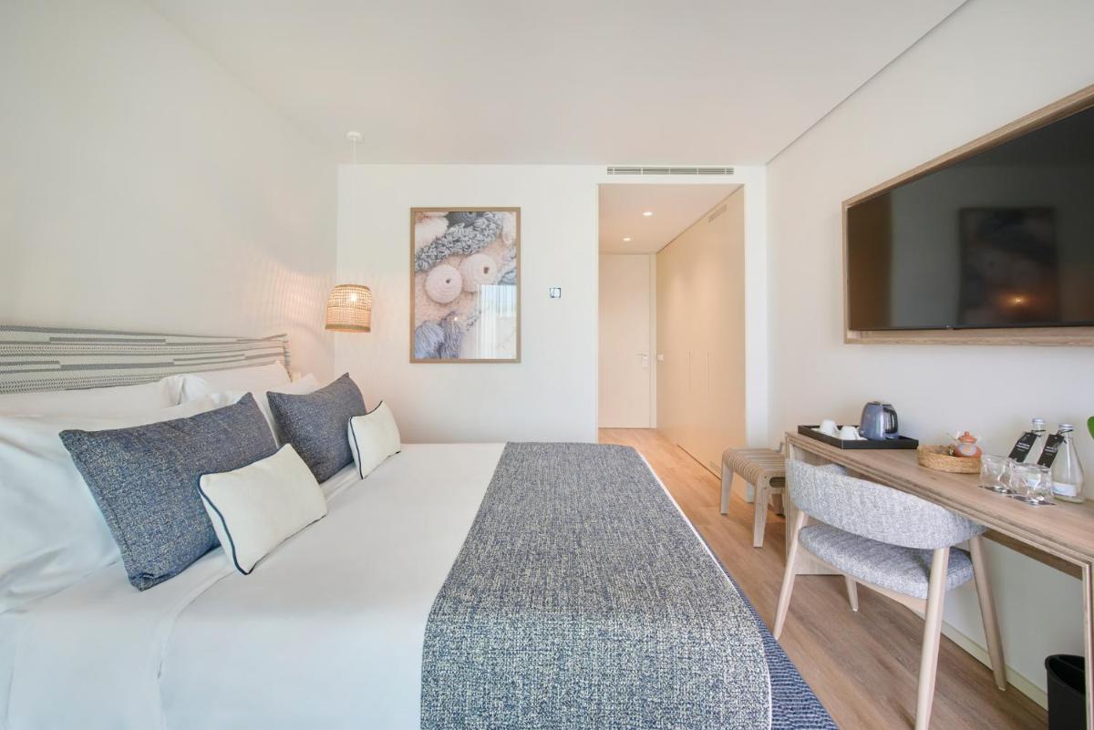 Uma cama ou camas num quarto em The Editory by the Sea Lagos