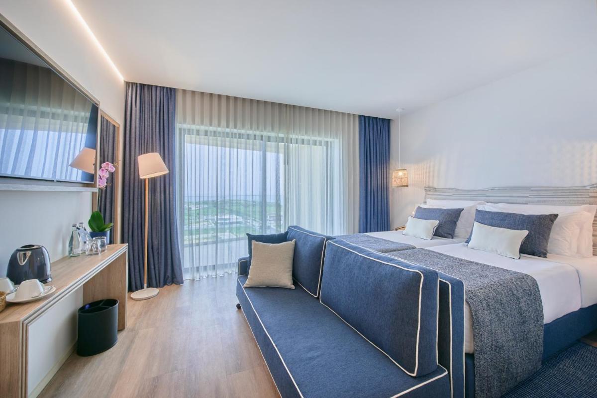 Uma cama ou camas num quarto em The Editory by the Sea Lagos