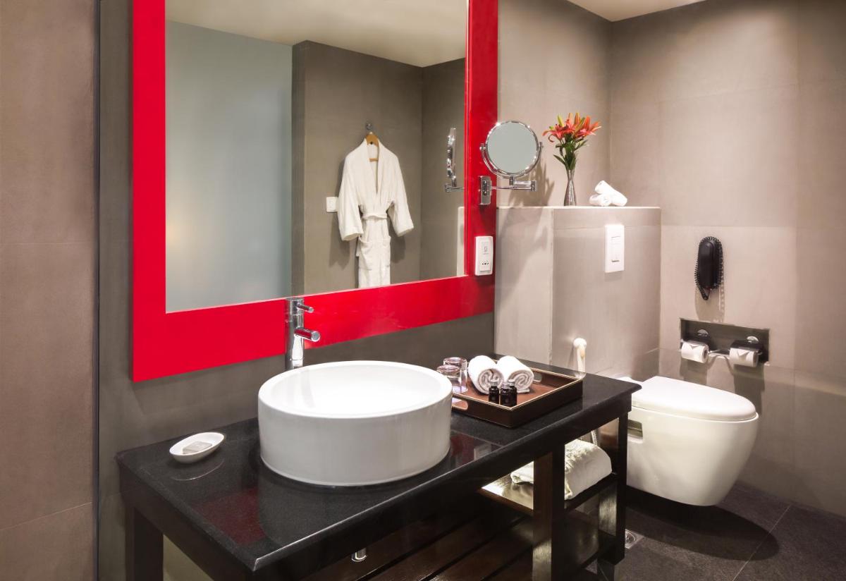 a bathroom with a sink and a toilet at Hard Rock Hotel Goa Calangute in Calangute
