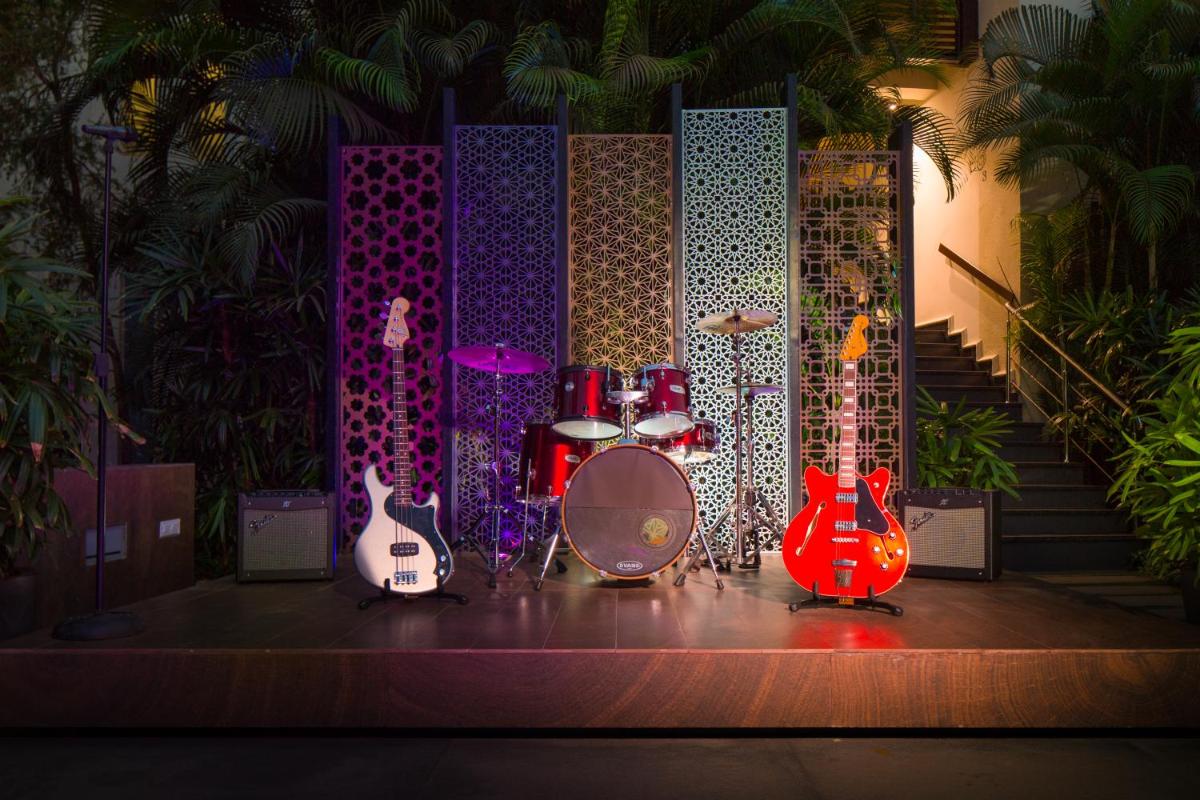 a stage with a group of guitars and drums on it at Hard Rock Hotel Goa Calangute in Calangute +48 photos