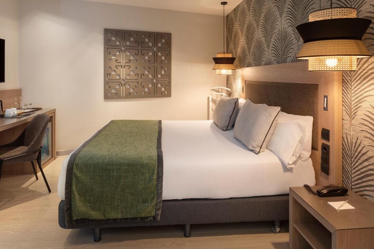 Cama o camas de una habitación en Catalonia Atocha