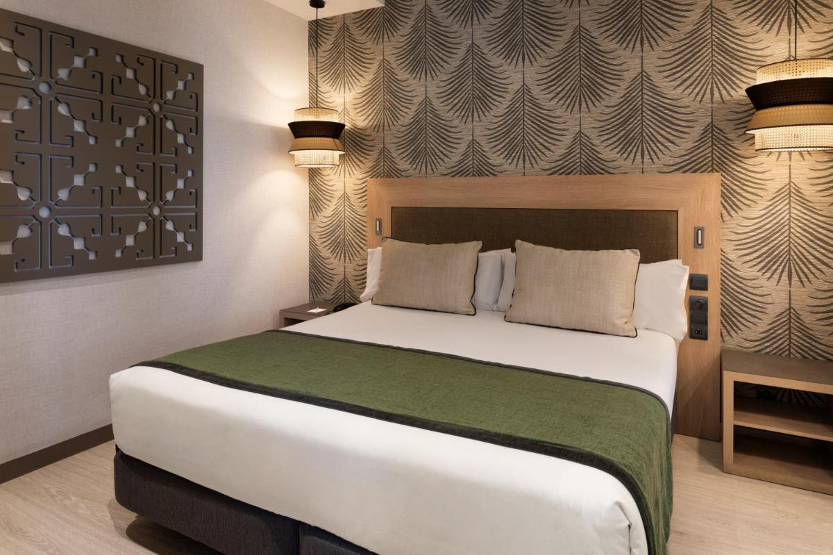 Cama o camas de una habitación en Catalonia Atocha