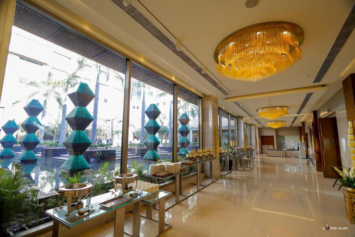 a lobby of a building with a large window at Crowne Plaza Today Gurugram by IHG in Gurgaon