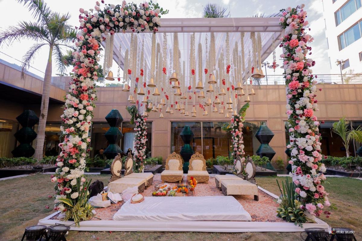 an arch with flowers and a chandelier in front of a building at Crowne Plaza Today Gurugram by IHG in Gurgaon