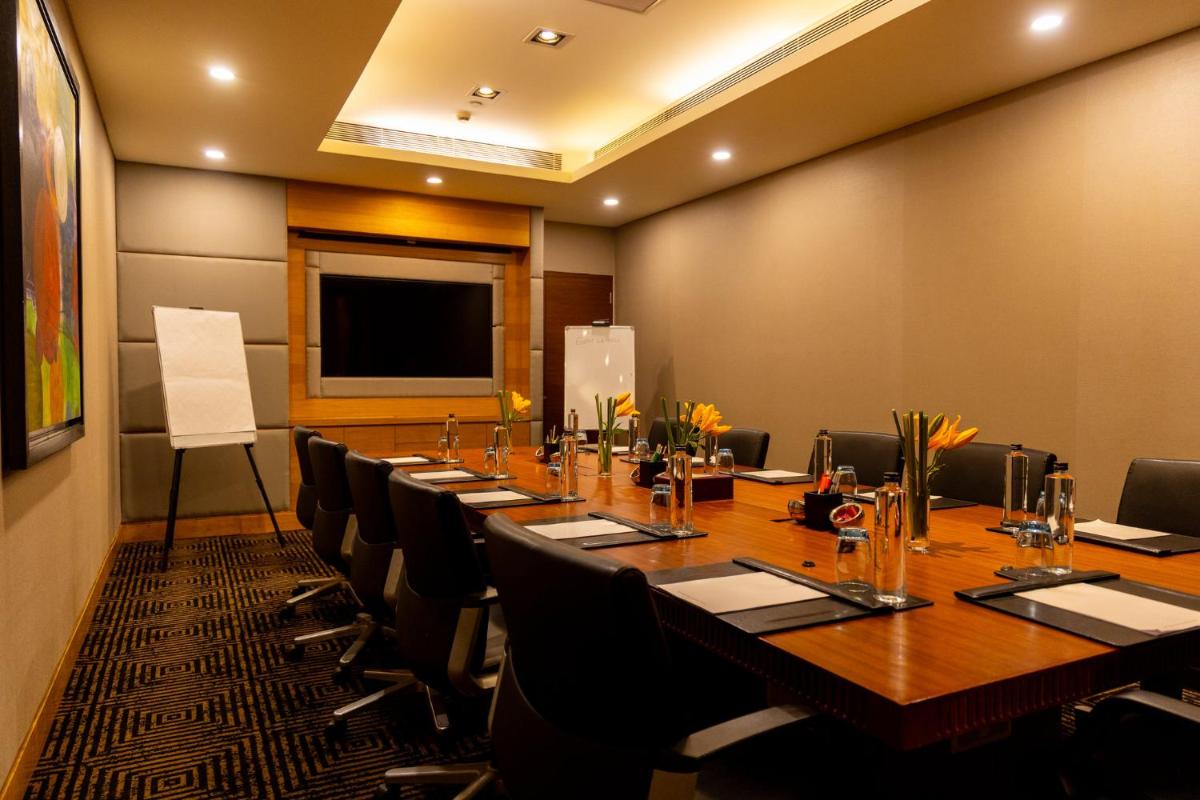 a large conference room with a long table and chairs at Crowne Plaza Today Gurugram by IHG in Gurgaon