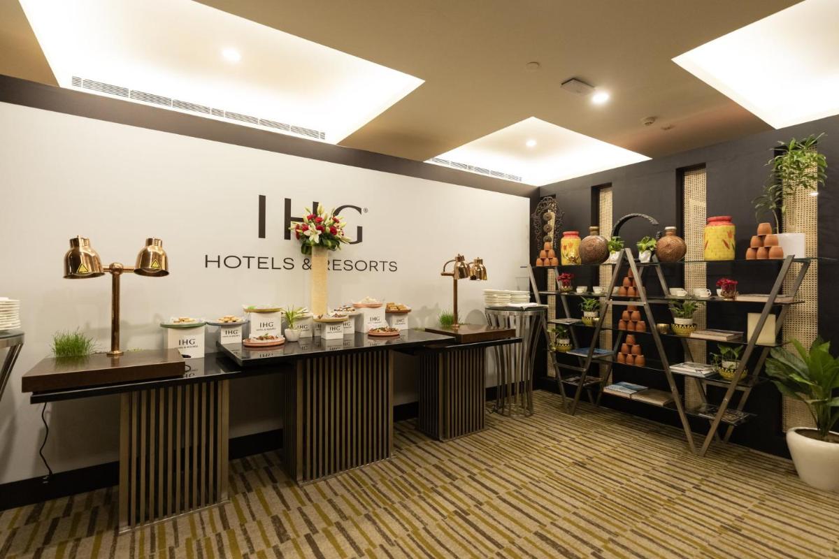 a lobby of a hotel room with a flower shop at Crowne Plaza Today Gurugram by IHG in Gurgaon