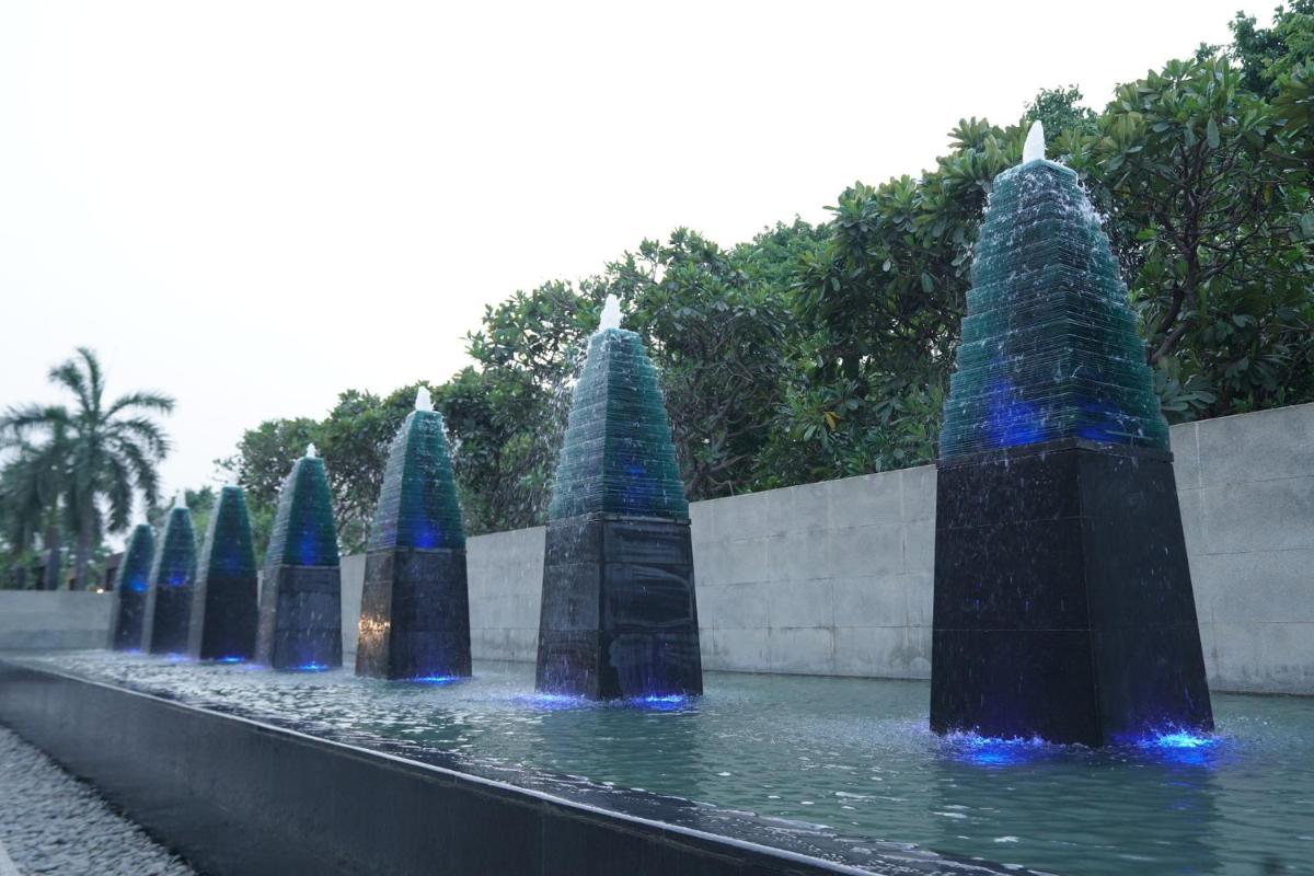a fountain with blue lights in the water at Crowne Plaza Today Gurugram by IHG in Gurgaon