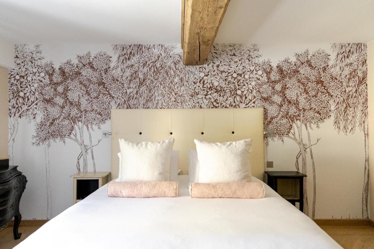 Un ou plusieurs lits dans un hébergement de l'établissement Maison Doucet - Relais & Châteaux