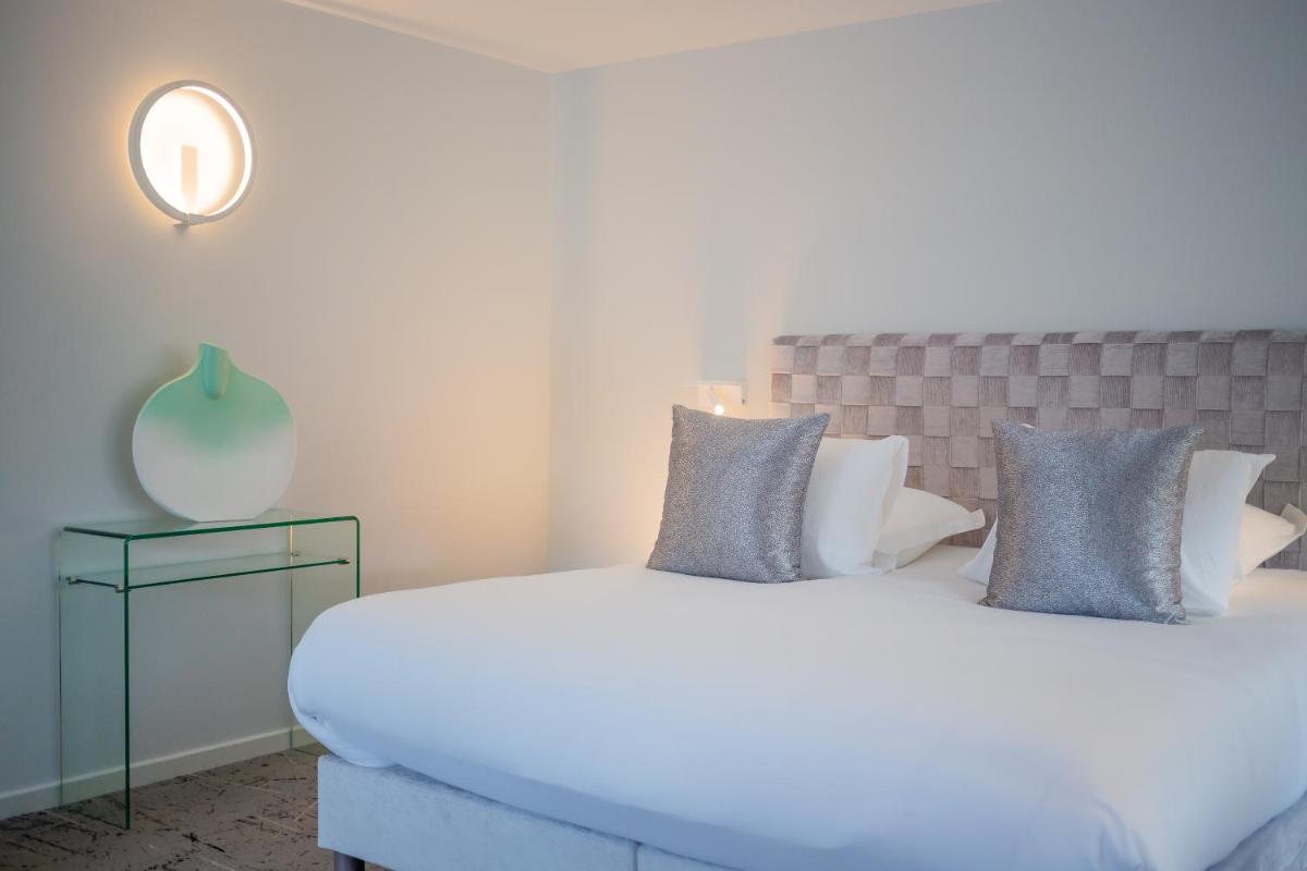 Un ou plusieurs lits dans un hébergement de l'établissement Maison Doucet - Relais & Châteaux