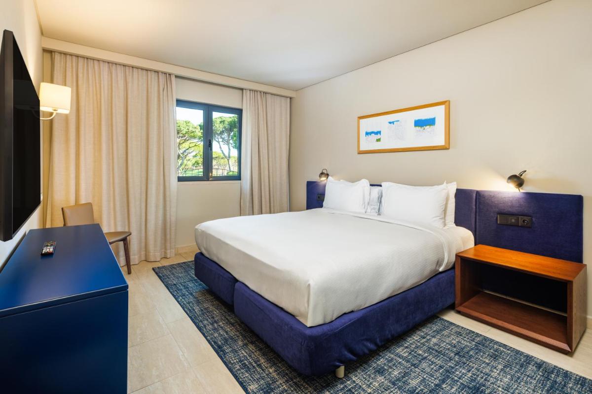 Uma cama ou camas num quarto em Hilton Vilamoura