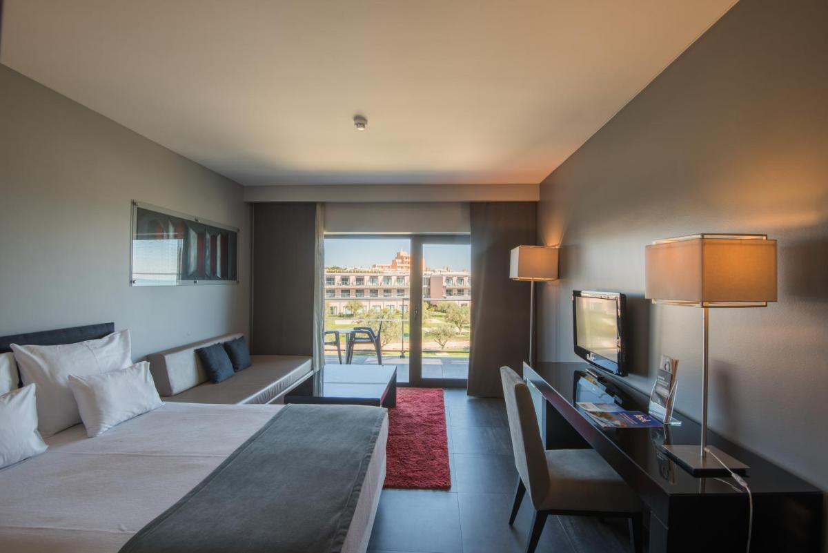 Uma cama ou camas num quarto em Vila Gale Lagos