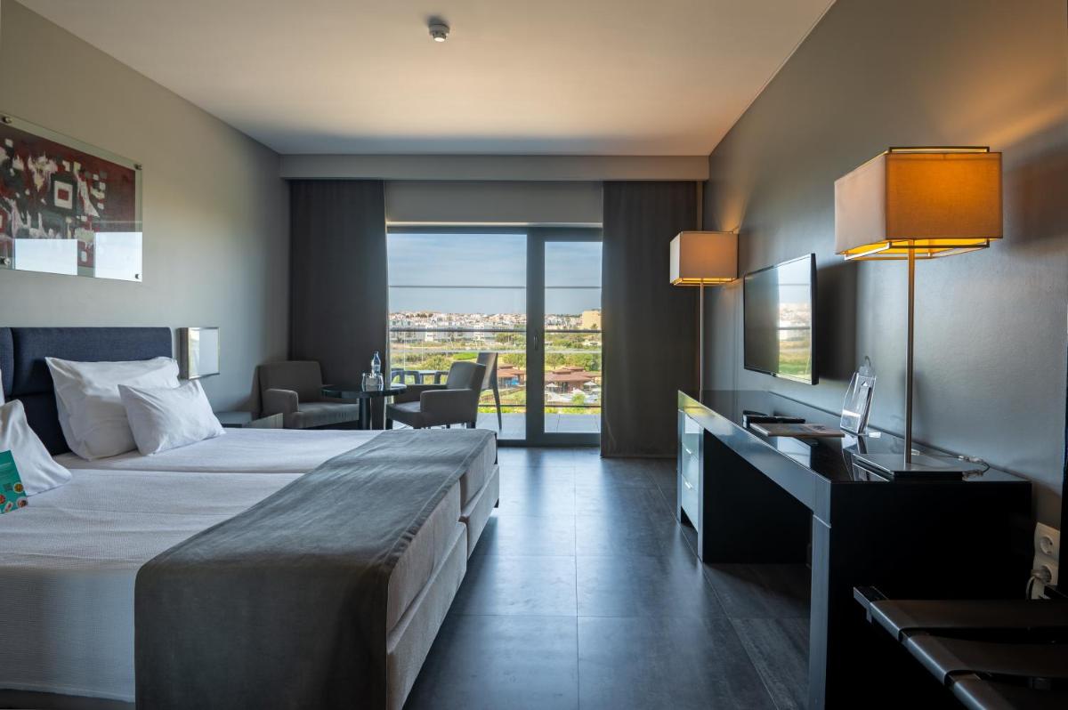 Uma cama ou camas num quarto em Vila Gale Lagos
