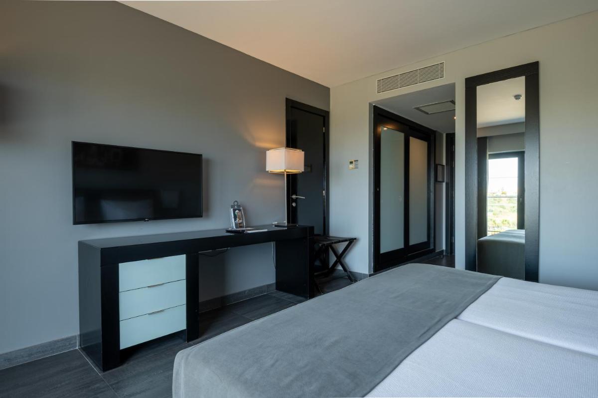 Uma cama ou camas num quarto em Vila Gale Lagos