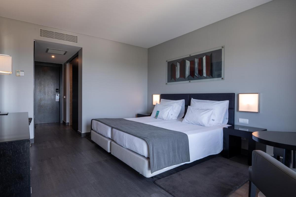 Uma cama ou camas num quarto em Vila Gale Lagos