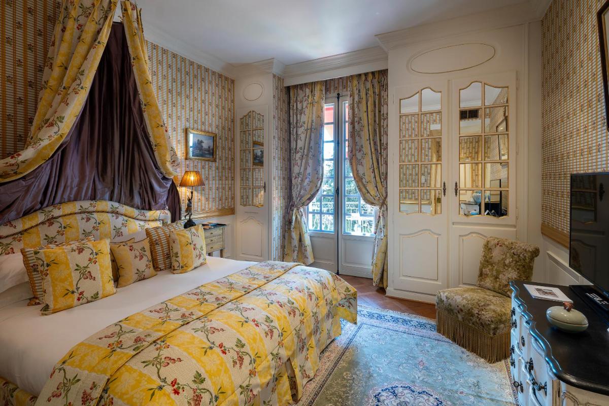 Un ou plusieurs lits dans un hébergement de l'établissement Villa Gallici Hôtel & Spa