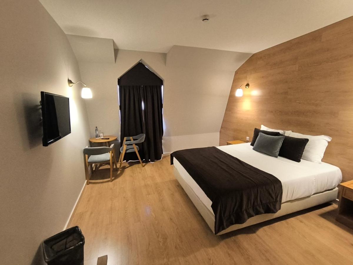 Uma cama ou camas num quarto em Douro Marina Hotel & SPA