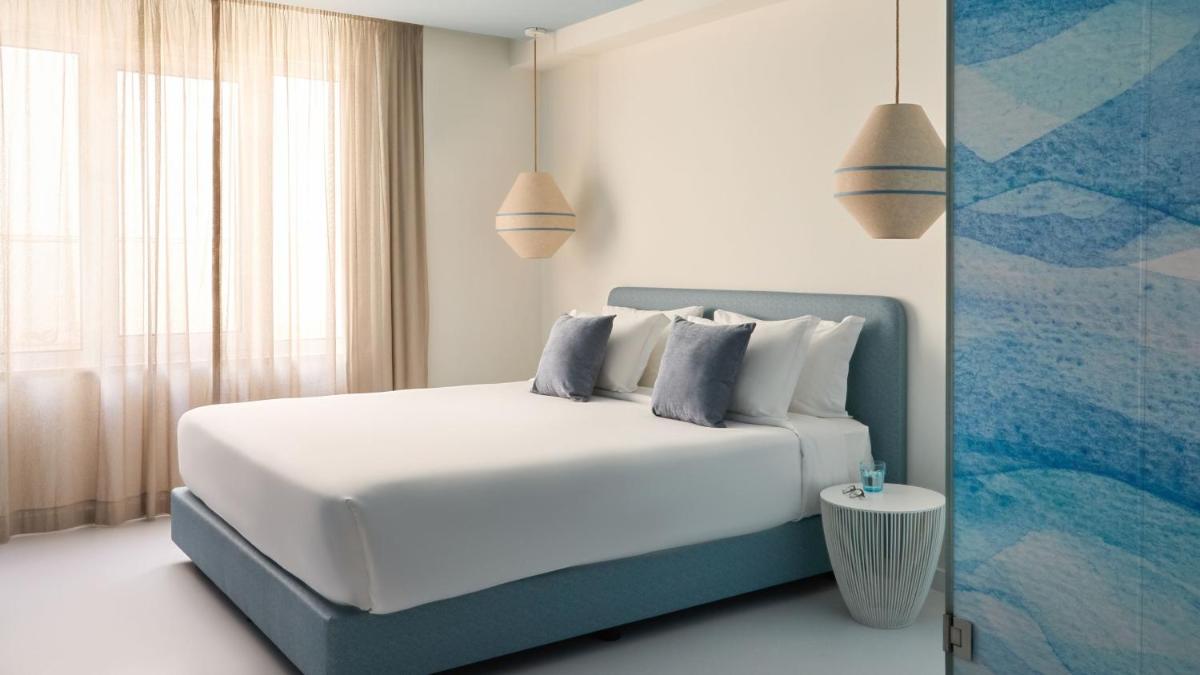 Uma cama ou camas num quarto em Hotel Indigo Albufeira by IHG